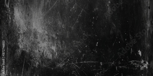 A grainy dark and textured black and white abstract background with subtle scratches and imperfections throughout the composition