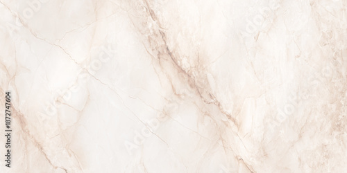 A close up view of a cream and beige marble texture with delicate flowing golden vein patterns