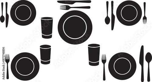 Black and white table setting with plates and utensils