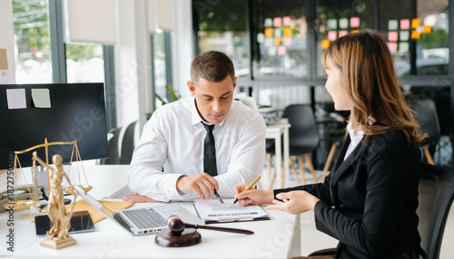 Professional lawyer consulting a client about legal contract in modern office, law and justice concept, business agreement, legal advice
