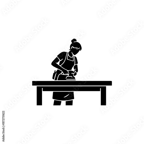 Female woodworker sanding a table. Solid black silhouette vector illustration. Minimalist carpenter icon isolated on white background. Craftsmanship and DIY concept