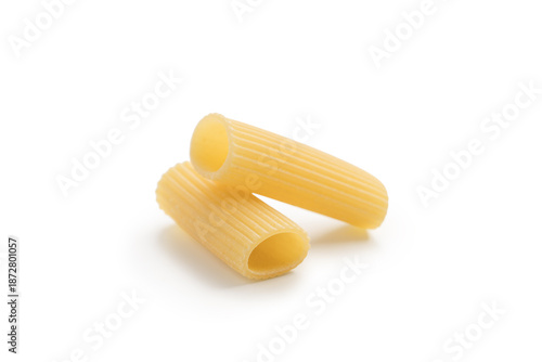 Italian dry rigatoni pasta over white background with shadow
