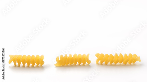 Tableau sur toile Italian dry fusilli pasta over white background with shadow