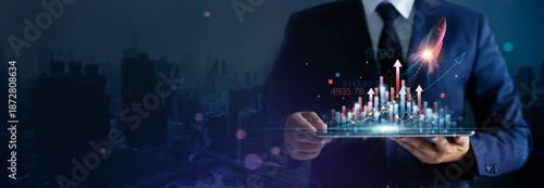 Obraz na plátne Businessman holding Startup rocket launch growth graph of business on tablet achieving goals with the rising arrow, Business strategy development and planning of successful