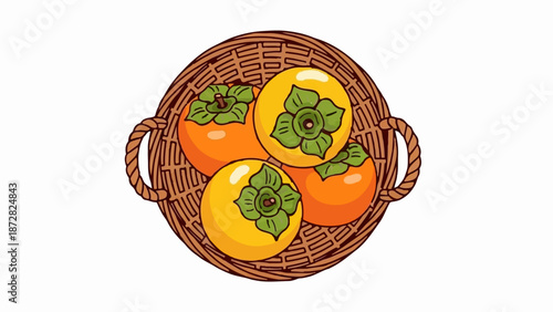 A woven basket holds four ripe persimmons, two orange and two yellow, each with green leafy tops