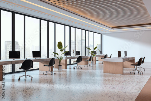 Modern open space office interior with city view through large windows, wooden desks, black chairs, and terrazzo flooring. 3D Rendering