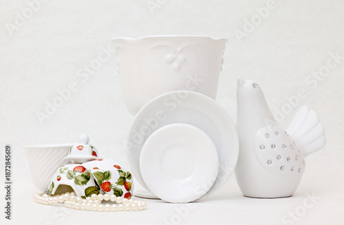 White different porcelain items on white background
