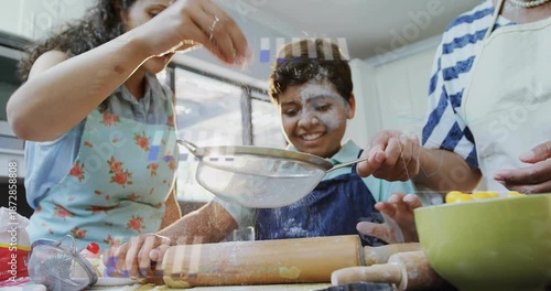 Mother lifting sieve triggers animated flour dust, guiding child rolling dough for baking teamwork
