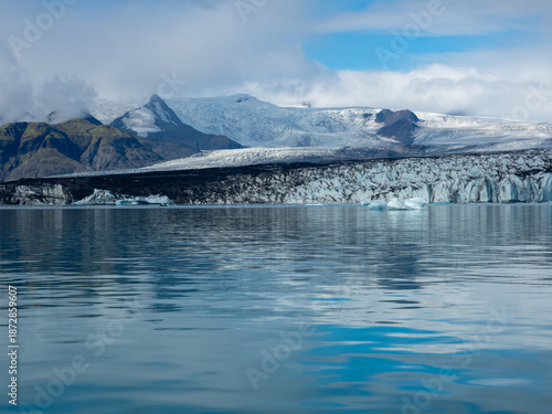 Glacier descending into water in Iceland's Jokulsarlon Glacier Lagoon