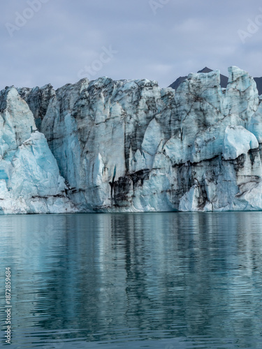 Close up view of glacier descending into water in Iceland's Jokulsarlon Glacier Lagoon