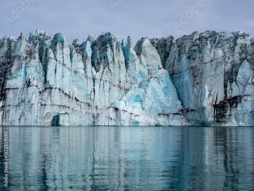 Close up view of glacier descending into water in Iceland's Jokulsarlon Glacier Lagoon