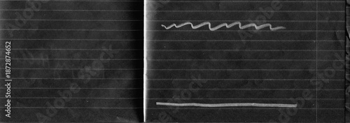 Lined notebook paper texture with fold crease, torn edge and black expressive pencil marks. Minimal yet emotional background combining stationery surface with abstract gesture and contrast