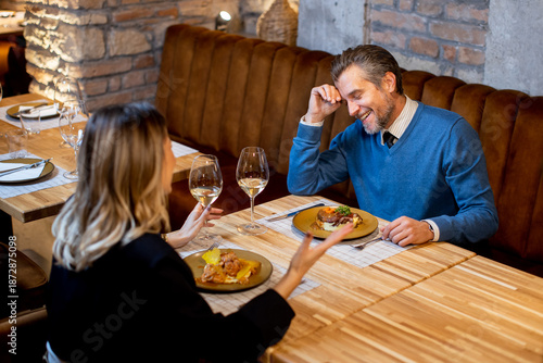 Couple enjoys dinner at a r...