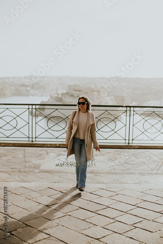 Woman walking along a sceni...