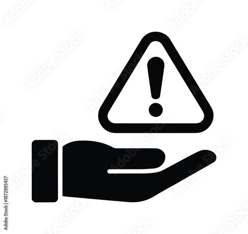 Hand holding vector warning sign of exclamation mark in triangle