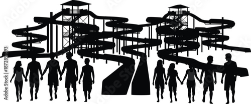 Group of people walking towards a large water slide complex with multiple slides and platforms silhouettes