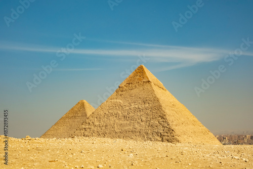 Exploring ancient pyramids at Giza in Egypt under a clear blue sky