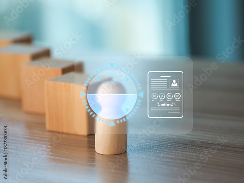 Wooden peg figure in front of blocks with transparent digital interface overlay showing profile and progress, symbolizing recruitment and candidate evaluation