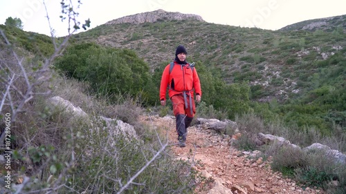 Man hiking outdoors on a winter day.