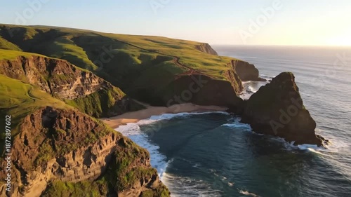 Serene Coastal Landscape at Sunset Waves Gently Kiss Rugged Cliffs and a Secluded Sandy Cove