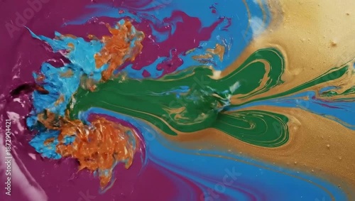Vibrant 4K Video of colorful liquids swirling together in a mesmerizing dance on a surface