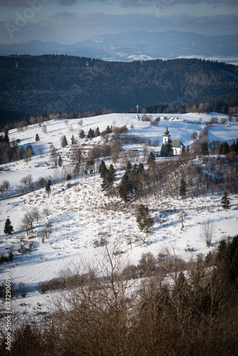 Historic Church of St. John the Baptist in the snowy Kremnica Mountains, Slovakia