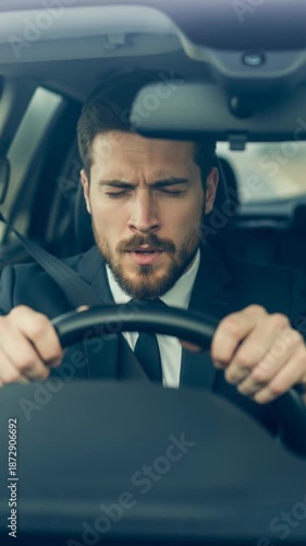 Stressed man gripping steering wheel while driving, vertical shot