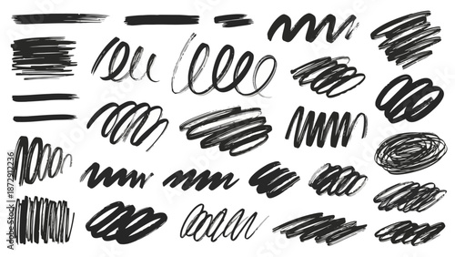 A collection of various black scribbles and lines drawn with a marker on a white background.