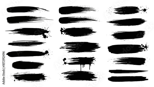 Collection of various black paint brush strokes and splatters on a white background, artistic design.