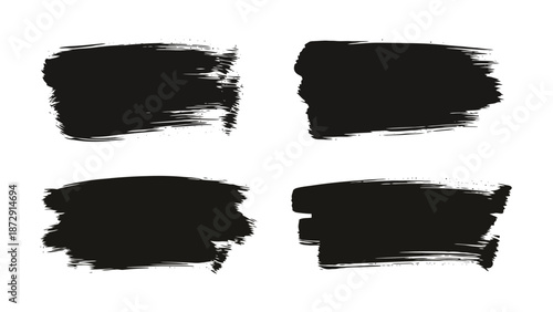 Four black brush stroke paint splatters on a white background, abstract art.
