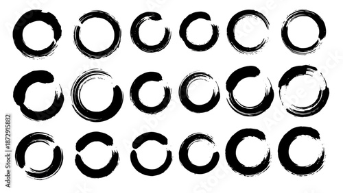 A collection of twenty-one black ink brush stroke circles and semi-circles on a white background.