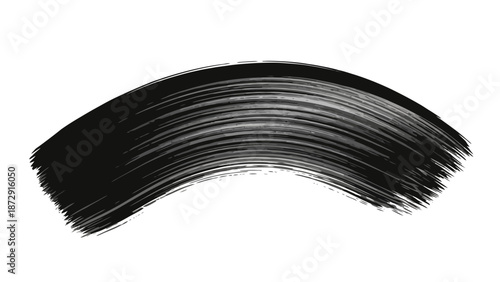 A single black brush stroke with fine bristles, creating a curved, sweeping motion on a white background.