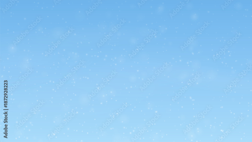 Fototapeta premium Gentle snowfall on light blue winter background