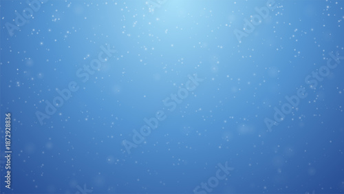 Soft snowfall over deep blue gradient background