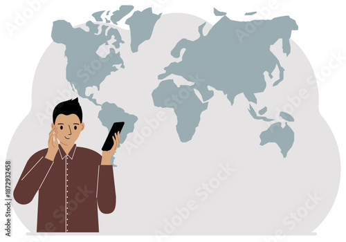 A man trying to make a call on a mobile phone against a world map.