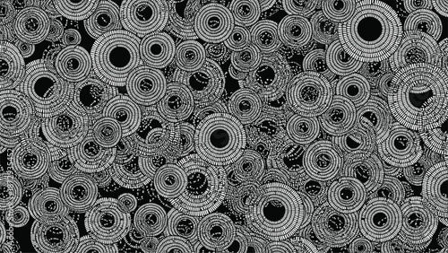 Abstract monochrome background with a complex pattern of overlapping hand-drawn concentric circles in white on black.
