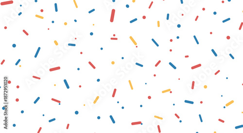 Vibrant pattern of colorful confectionery sprinkles with tiny sticks and dots in red, yellow, and blue on a white background.