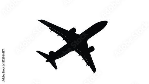 Silhouette of a large passenger jet airplane flying high above the clouds captured