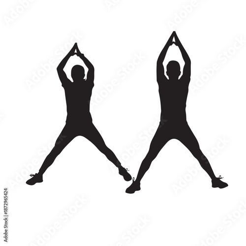Silhouette of people practicing yoga in warrior pose with hands together in soft natural lighting for wellness and fitness