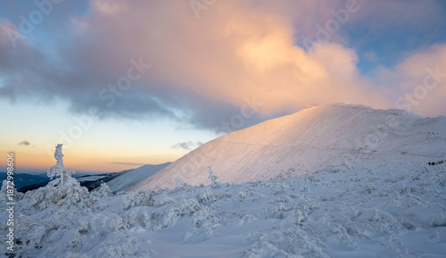 amazing view on Snezka peak during winter sunset in Karkonosze mountains