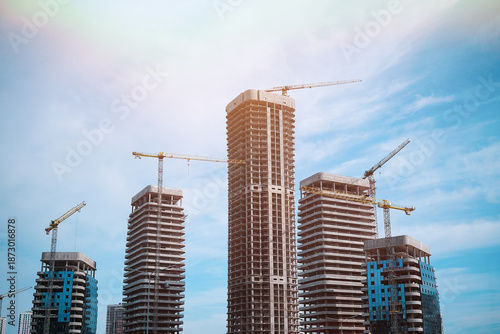 Tall modern building being built from concrete. High quality photo