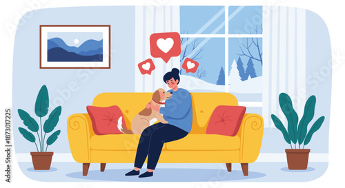 Young woman sitting on a yellow sofa and cuddling her pet dog with heart symbols showing love during a snowy winter day.