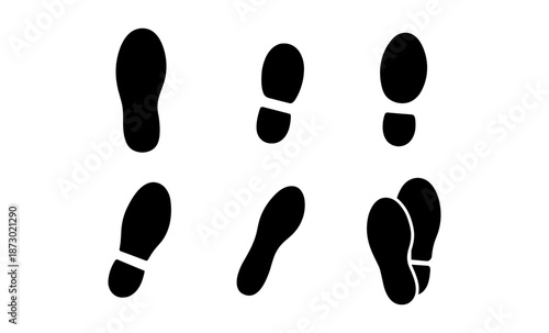 Collection of black shoe footprints on a white background, showing different angles and steps