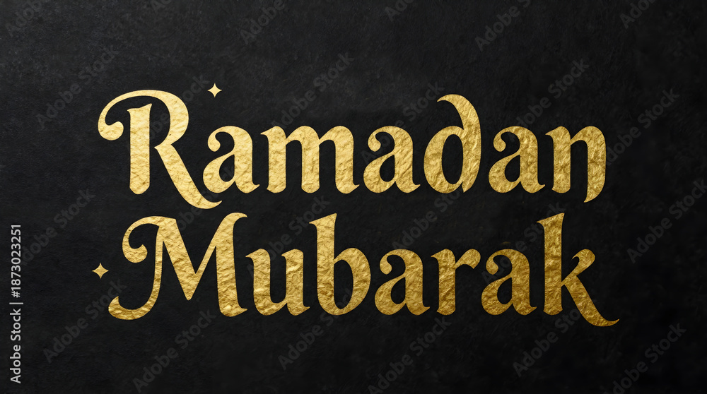 Fototapeta premium A Ramadan Mubarak greeting card with gold text on a black background
