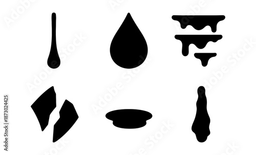 Collection of black liquid drips and splatters on a white background