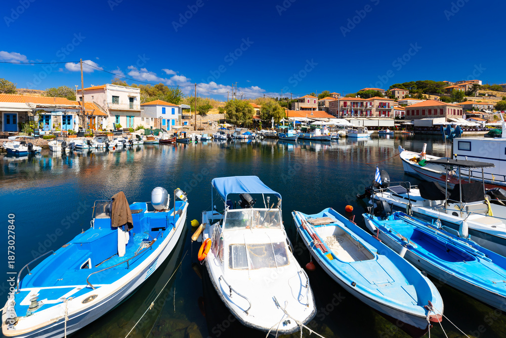 Fototapeta premium The charming Mediterranean port village of Molivos (Mithymna) on the Greek island of Lesvos on a sunny day, wallpaper or background for your project
