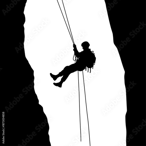 A person rappelling down a steep cliff face with ropes and gear