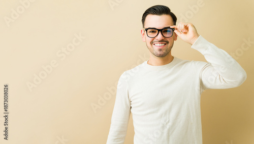 Cuadro en lienzo Smiling man adjusting glasses, having good eyesight and clear vision, happy pers