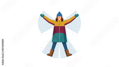Woman making a snow angel in winter clothes.