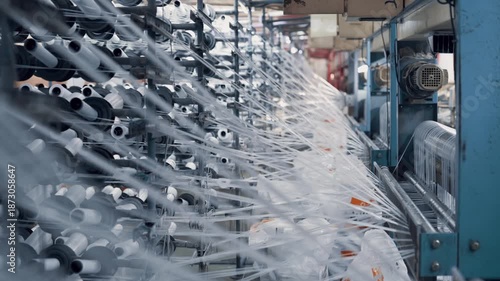 Operation of a flat-slot extruder in the production of polypropylene bags.